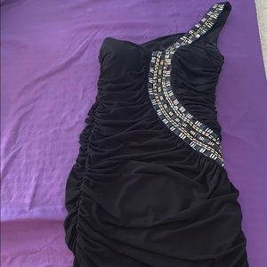 A gorgeous short black one strapped dress